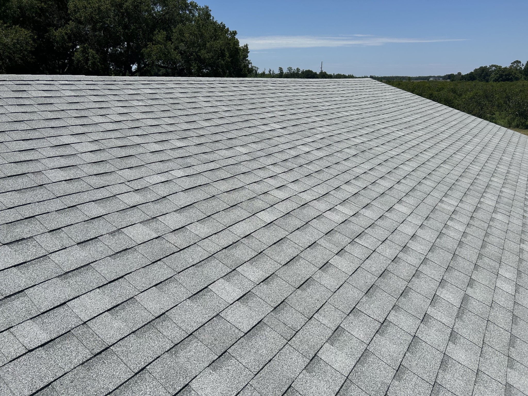 Close-up of architectural asphalt shingles installed on a residential roof