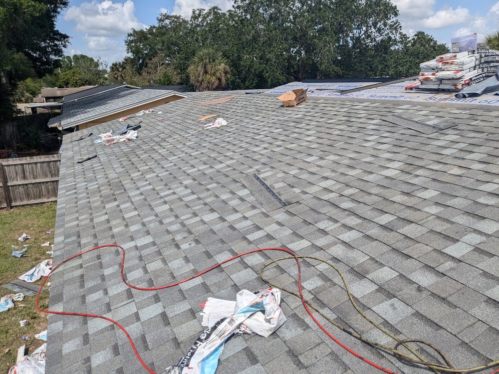 Homeowner protecting interior from roof leak damage