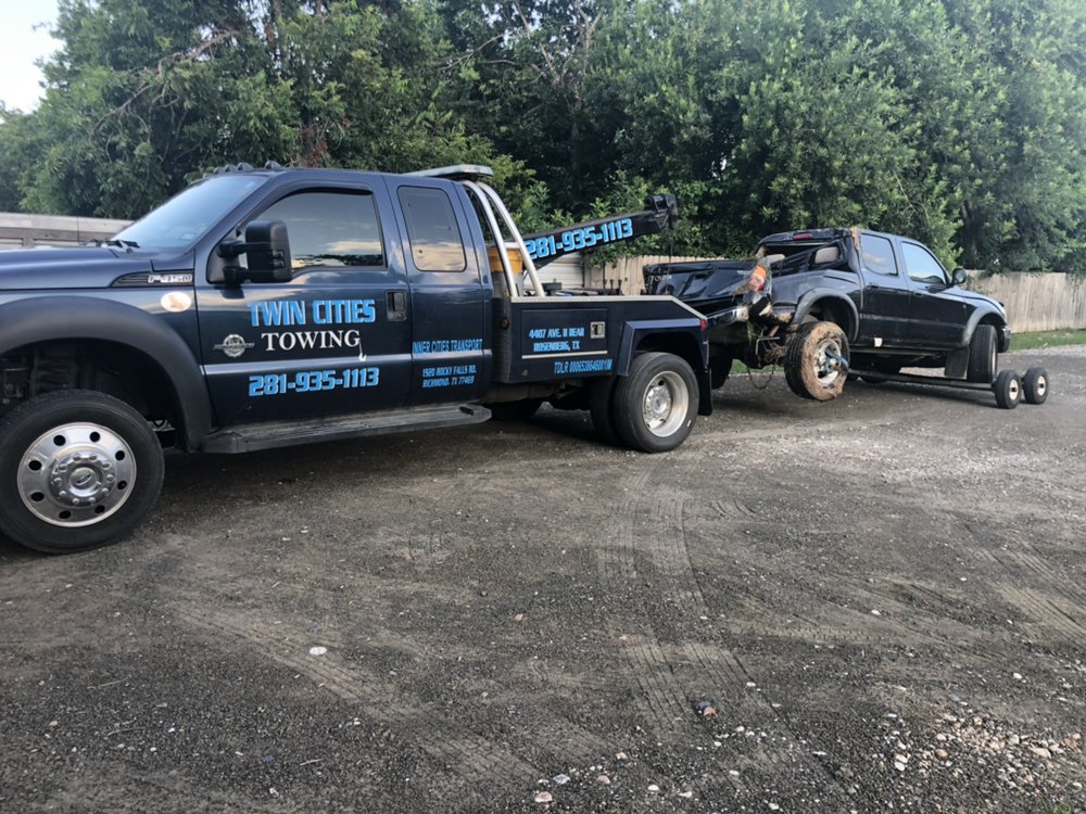 Twin Cities Towing truck loaded for transport in Richmond TX