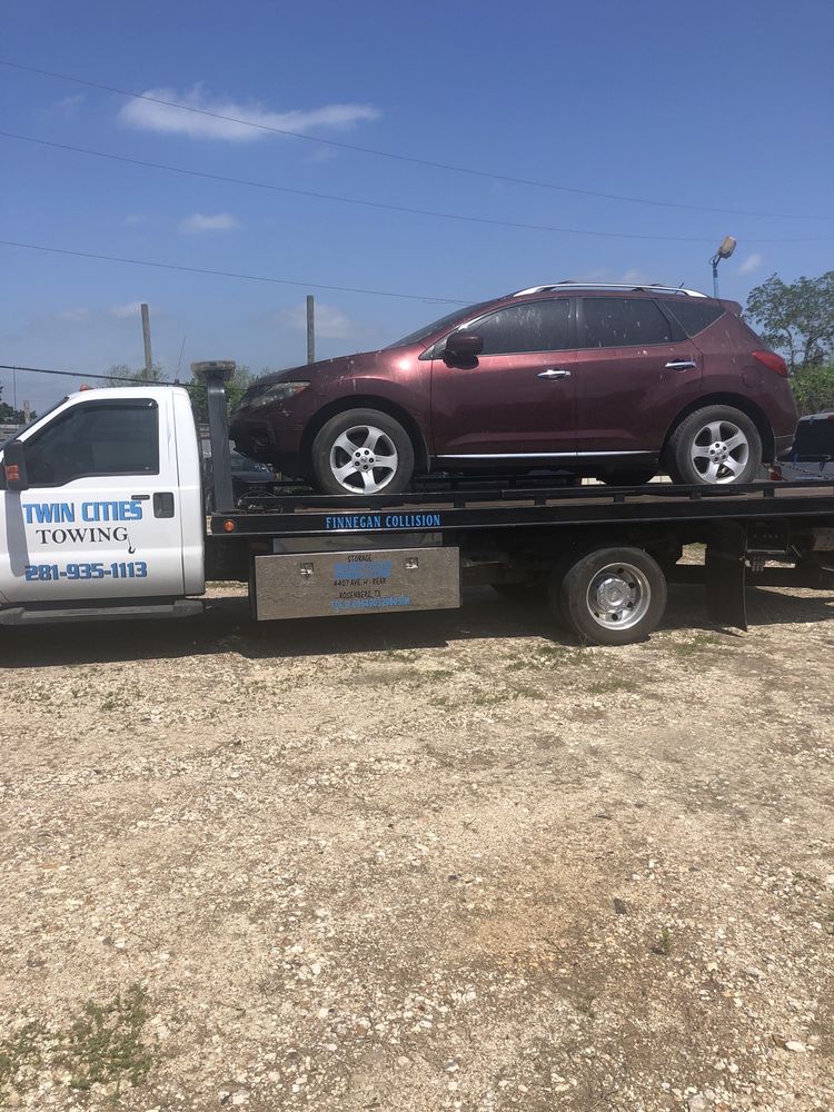 Twin Cities Towing INC tow truck loading a vehicle in Richmond, TX — complete local towing guide for Fort Bend County drivers